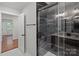 Bathroom showcases a modern black marble shower and a new vanity at 1115 Sides Rd, Salisbury, NC 28146