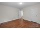 Bedroom features hardwood floors, a door, and neutral paint at 1115 Sides Rd, Salisbury, NC 28146