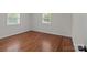 Bedroom features hardwood floors, windows, and neutral paint at 1115 Sides Rd, Salisbury, NC 28146