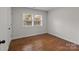 Bedroom with hardwood floors, window, and base molding at 1115 Sides Rd, Salisbury, NC 28146