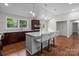 Modern kitchen features stainless steel appliances, a quartz island, and custom cabinetry at 1115 Sides Rd, Salisbury, NC 28146