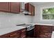 New kitchen with stainless appliances, shaker cabinets and stylish tile backsplash at 1115 Sides Rd, Salisbury, NC 28146