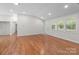 Spacious living room with hardwood floors, white walls, and plenty of natural light at 1115 Sides Rd, Salisbury, NC 28146