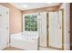 Bright bathroom featuring a shower and a soaking tub at 116 Scottie Ct, Rock Hill, SC 29730