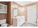 Bright bathroom featuring double vanity, decorative lighting, and a spacious layout at 116 Scottie Ct, Rock Hill, SC 29730