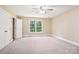 Large carpeted bedroom features double doors, windows and a ceiling fan at 116 Scottie Ct, Rock Hill, SC 29730