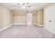 Spacious carpeted bedroom features windows and access to other rooms at 116 Scottie Ct, Rock Hill, SC 29730