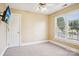 Bright bedroom with a ceiling fan and large windows overlooking the yard at 116 Scottie Ct, Rock Hill, SC 29730