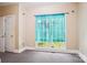 Neutral bedroom features carpet, double hung windows with sheer turquoise curtains at 116 Scottie Ct, Rock Hill, SC 29730