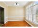 Dining room with hardwood floors, large windows, classic trim and a modern chandelier at 116 Scottie Ct, Rock Hill, SC 29730