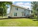 Back exterior of home with a spacious wooden deck and lush lawn at 116 Scottie Ct, Rock Hill, SC 29730