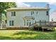 Back exterior of home with a spacious wooden deck and lush lawn at 116 Scottie Ct, Rock Hill, SC 29730