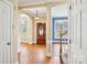 Welcoming foyer with hardwood floors, a decorative front door, and views to the living room and staircase at 116 Scottie Ct, Rock Hill, SC 29730