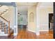 Inviting foyer with hardwood floors, staircase, and open view to the living spaces beyond at 116 Scottie Ct, Rock Hill, SC 29730