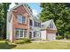 Two-story home boasts brick accents, light siding, a two-car garage, and a well-maintained lawn at 116 Scottie Ct, Rock Hill, SC 29730