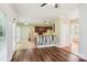 Open-concept living area features hardwood floors, white trim, and seamless access to the kitchen at 116 Scottie Ct, Rock Hill, SC 29730