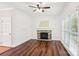 The living room features a decorative fireplace, hardwood floors, white walls, and natural light at 116 Scottie Ct, Rock Hill, SC 29730
