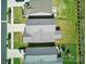 Aerial view of rooftops and backyards of a row of suburban homes in a well-maintained community at 1207 Laggan Ln, Indian Trail, NC 28079
