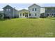 Backyard featuring a large lawn and a view of the home's covered patio at 1207 Laggan Ln, Indian Trail, NC 28079
