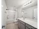 Bathroom featuring a shower/tub combination and a vanity with gray cabinets at 1207 Laggan Ln, Indian Trail, NC 28079