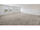 Bright and airy bedroom with neutral carpet and three windows, offering plenty of natural light at 1207 Laggan Ln, Indian Trail, NC 28079
