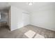 Bedroom with neutral carpet and white closet with doors at 1207 Laggan Ln, Indian Trail, NC 28079
