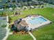 Aerial image of a community pool, showcasing its size, lounge chairs, and proximity to the surrounding homes at 1207 Laggan Ln, Indian Trail, NC 28079