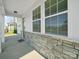 Close-up of the stone front porch with a great view of the house siding at 1207 Laggan Ln, Indian Trail, NC 28079
