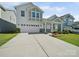 Inviting exterior view of home highlighting a well-manicured lawn and an attached garage at 1207 Laggan Ln, Indian Trail, NC 28079