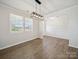 Neutral living room highlighting luxury vinyl plank flooring, light walls, and an open concept design at 1207 Laggan Ln, Indian Trail, NC 28079