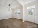 Bright living room with luxury vinyl plank flooring, neutral walls, and natural light at 1207 Laggan Ln, Indian Trail, NC 28079