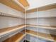 Spacious pantry featuring wooden shelving and white wire racks for optimal storage solutions at 1207 Laggan Ln, Indian Trail, NC 28079