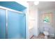 A full bathroom featuring a shower, single vanity, and blue accents at 1216 Manchester Ln, Charlotte, NC 28227