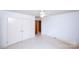 Bright bedroom featuring neutral walls, ceiling fan, and closet for storage at 1216 Manchester Ln, Charlotte, NC 28227