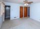 A primary bedroom featuring a closet, ensuite bathroom, and neutral carpet at 1216 Manchester Ln, Charlotte, NC 28227
