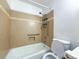 Well-maintained bathroom with tiled walls, grab bars, and accessible features ensuring safety and convenience at 1227 Flowe Dr, Matthews, NC 28104
