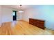 Spacious bedroom featuring an ornate wooden dresser and hardwood flooring at 1227 Flowe Dr, Matthews, NC 28104