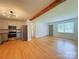 Open-concept living space with modern kitchen, hardwood floors and large windows at 1227 Flowe Dr, Matthews, NC 28104