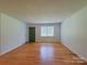 Bright living room with hardwood floors and plenty of natural light at 1227 Flowe Dr, Matthews, NC 28104