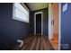 Small room with paneled walls and wood-look flooring at 1227 Flowe Dr, Matthews, NC 28104