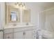 Bright bathroom featuring a double sink vanity with framed mirrors and a tub-shower combination at 12342 Swan Wings Pl, Huntersville, NC 28078