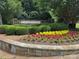 Stone entrance sign for Tanners Creek community with lush landscaping at 12342 Swan Wings Pl, Huntersville, NC 28078