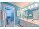Bright bathroom featuring a double vanity, stylish fixtures, and a separate toilet area, providing convenience at 1240 Fawn Ridge Nw Rd, Concord, NC 28027