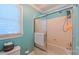 Cozy bathroom with a shower-tub combination, neutral finishes, and a window for natural light at 1240 Fawn Ridge Nw Rd, Concord, NC 28027