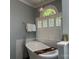 Luxurious soaking tub under an arched window, complemented by a stylish faucet, and modern fixtures at 1240 Fawn Ridge Nw Rd, Concord, NC 28027