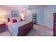 Comfortable bedroom featuring a ceiling fan, a queen-sized bed, and neutral-toned carpet at 1240 Fawn Ridge Nw Rd, Concord, NC 28027
