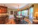 Charming dining room features a wood table, chandelier, and decorative window treatments, perfect for Gathering meals at 1240 Fawn Ridge Nw Rd, Concord, NC 28027