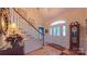 Grand foyer featuring a staircase, hardwood floors, and an elegant front door with decorative glass at 1240 Fawn Ridge Nw Rd, Concord, NC 28027