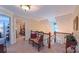 Bright hallway with a decorative bench, leading to other rooms, showcasing the home's layout and design at 1240 Fawn Ridge Nw Rd, Concord, NC 28027