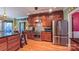 Well-equipped kitchen featuring custom wood cabinets, stainless steel appliances, and hardwood floors at 1240 Fawn Ridge Nw Rd, Concord, NC 28027
